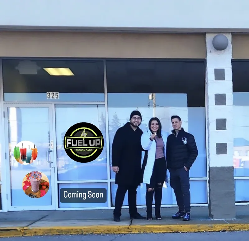 The Fuel Up Energy Cafe storefront at 325 N Weber Road before opening, with the founders out front