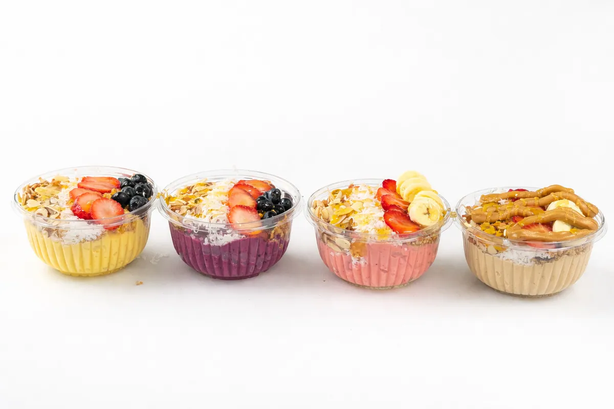 Four Fuel Up superfood bowls topped with fruit, granola and coconut