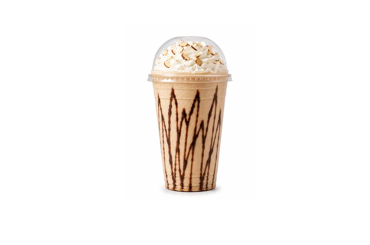 Almond Joy protein shake with chocolate drizzle and almond topping