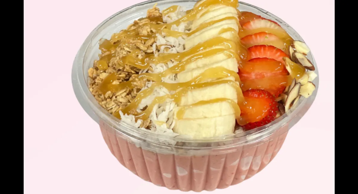 Berry Mango Bowl with granola, almonds, coconut, strawberries, banana and honey