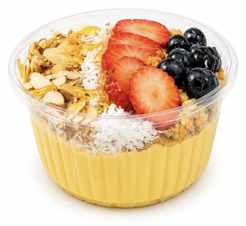 Mango Bowl topped with granola, almonds, coconut, strawberries and blueberries