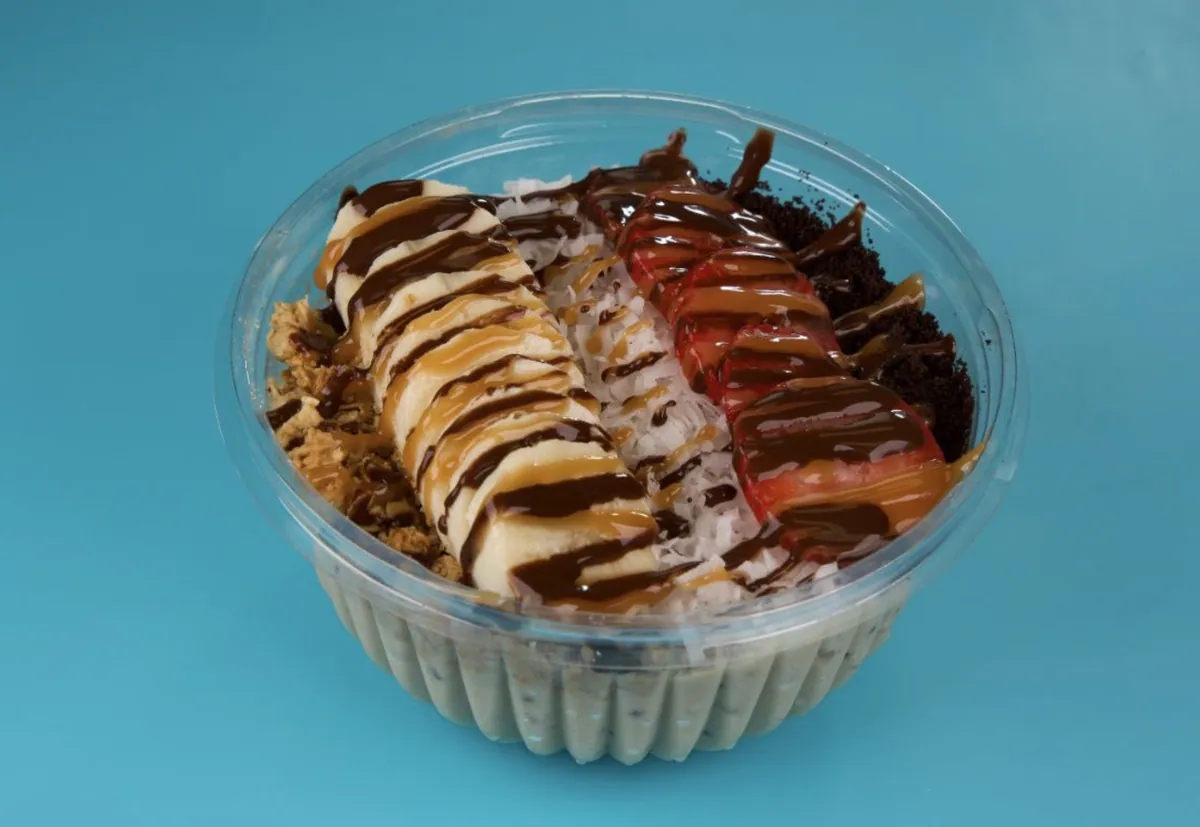 Oreo Bowl with granola, Oreo crumbs, strawberries, banana and drizzle